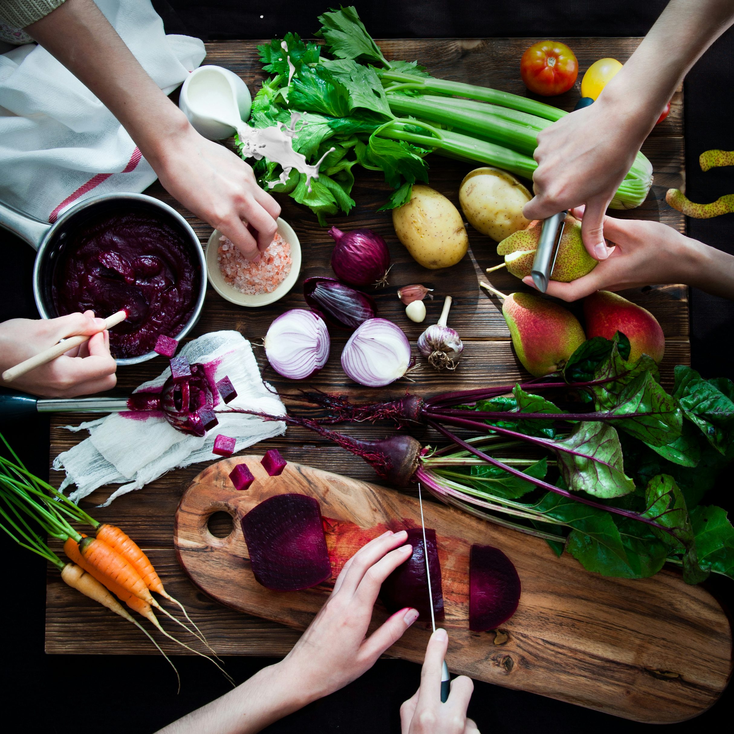 Hands preparing fresh ingredients over a cutting board
